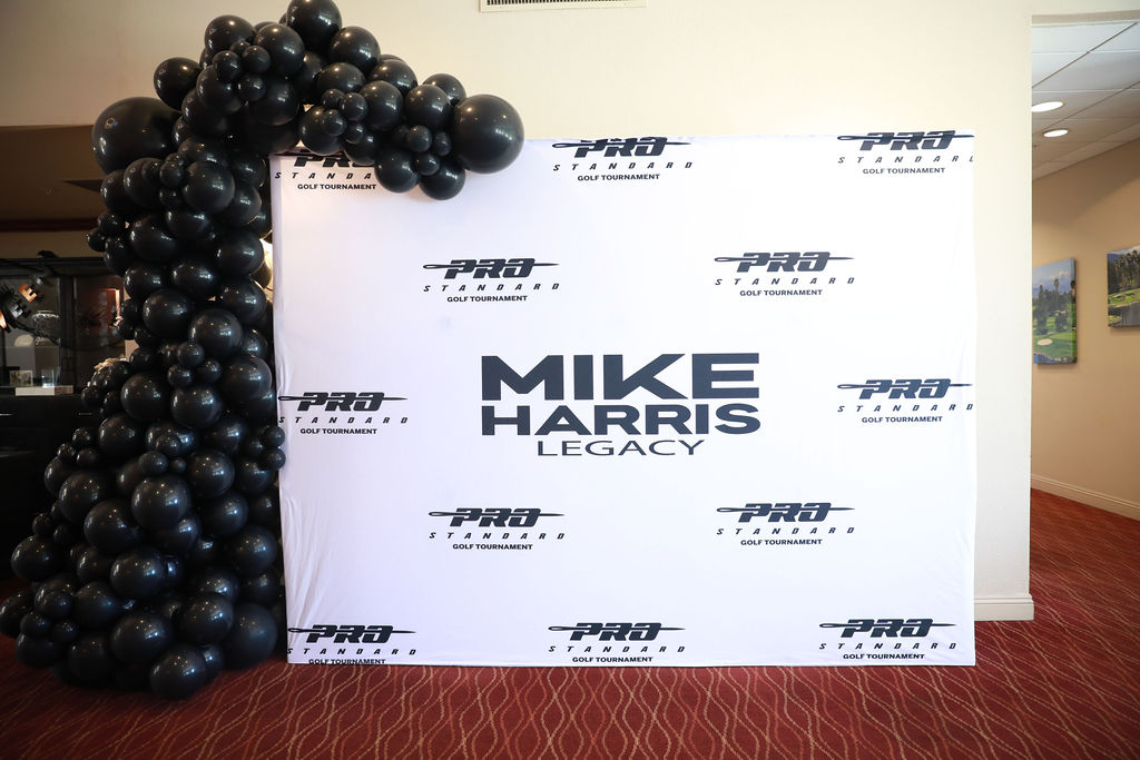 Mike Harris Legacy and Pro Standard media backdrop at the clubhouse