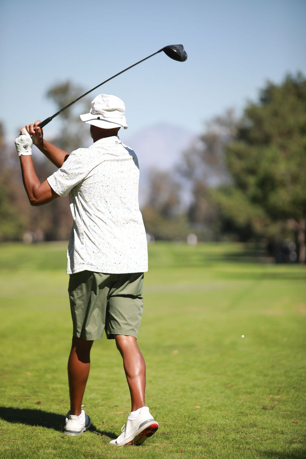 Player watching a drive from the tee box